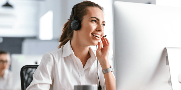 canva-woman-smiling-talking-on-headset