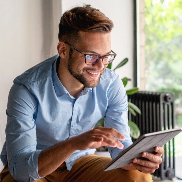 Man using ipad by window 2-1-1