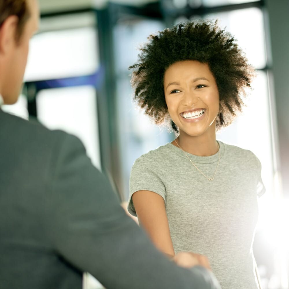 smiling-woman-shaking-hands