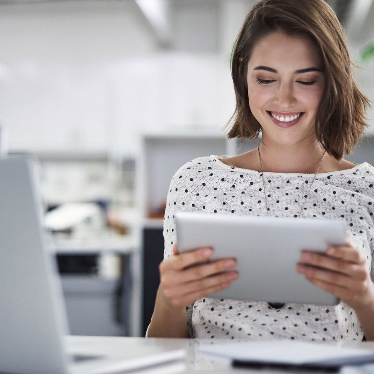 woman-looking-down-at-tablet